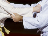 Detail of the Hands of Judo Competitors in Action Photographic Print