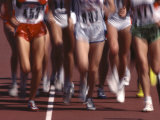 Blurred Action of Women Runners During a Track Race Photographic Print by Steven Sutton