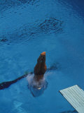 Female Diver Splashes Through the Surface of the Water Photographic Print