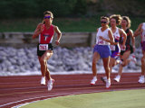 Female Runners Competing in a Track Race Lámina fotográfica