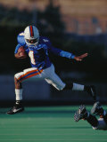 Football Player in Action Photographic Print
