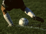 Detail of Foot About to Kick a Soccer Ball Photographie par Paul Sutton