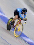 Blured Action of Female Cyclist Competing on the Velodrome Photographic Print