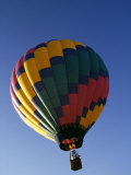 Hot Air Balloon in Flight Photographic Print by Paul Sutton
