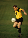 Soccer Player in Action Photographic Print