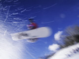 Blurred Action of Snowboarder in Flight, Aspen, Colorado, USA Lámina fotográfica