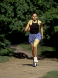 Hispanic Woman Running for Exercise, New York, New York, USA Photographic Print by Paul Sutton