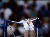 Detail of the Hands of Male Gymnast Grabing the High Bar Photographic Print by Paul Sutton