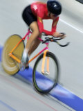 Blured Action of Female Cyclist Competing on the Velodrome Photographic Print