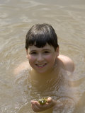 9 Year Old Boy Showing Off His Frog in a Pond, Woodstock, New York, USA Lámina fotográfica por Paul Sutton