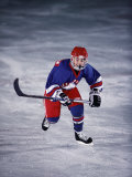 Young Ice Hockey Player in Action Photographic Print