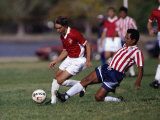 Soccer Players Fighting for the Ball Photographic Print