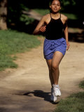 Hispanic Woman Running for Exercise, New York, New York, USA Photographic Print by Paul Sutton