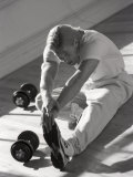 Man Stretching in Gym, New York, New York, USA Photographic Print by Chris Trotman