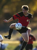 Soccer Player in Action Photographic Print