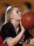 Female High School Basketball Players in Action Shooting a Free Throw During a Game Photographic Print