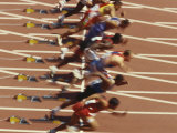 Blurred Action of Male Runners Starting a 100 Meter Sprint Race Photographic Print by Paul Sutton