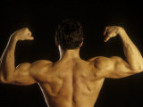 Young Adult Male Posing with Arms Flexed Lámina fotográfica por Chris Trotman Young Adult Male Posing with Arms Flexed Lámina fotográfica por Chris Trotman