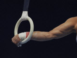 Detail of the Hands of Male Gymnast Grabing the Ring Photographic Print by Paul Sutton