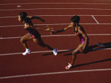Female Runner Competing in a Relay Track Race Photographic Print