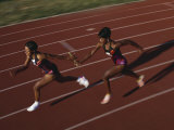 Female Runner Competing in a Relay Track Race Photographic Print