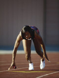 Female Runner Competing in a Track Race Photographic Print