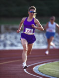 Female Runner Competing in a Track Race Photographie