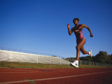 Female Runner Training on the Track Photographic Print