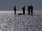 Survey Team Maps a Runway for Wheeled Planes on a Bare Ice Glacier Photographie par Gordon Wiltsie