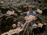 Woman Sits in a Boat Among the Lotuses,A Common Louisiana Flower Photographic Print by Edwin L. Wisherd