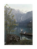 Man and Woman Row in a Boat on the Obersee Lake Near the Mountains Photographic Print by Hans Hildenbrand