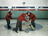 Red-Blazered Men Sweep Brooms on an Ice Rink in a Game of Curling Photographic Print by Jack Fletcher