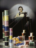 Woman Sews with Spools of Thread in Foreground Photographic Print by Willard Culver