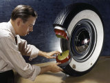 Technician Shows How a Second Inner Tube Reinforces Safety in Tires Photographic Print by Willard Culver
