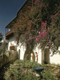 Women Talk in the Courtyard of the Historic Casa Blanca Photographic Print by Edwin L. Wisherd