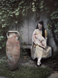 Young Lady Sits on a Bench by a Vase in a French Quarter Garden Photographic Print by Edwin L. Wisherd