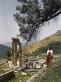 Three Restored Doric Columns Stand at the Ancient Greek Tholos Photographic Print by B. Anthony Stewart