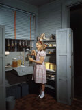 Girl Fills Hummingbird Feeders with Honey-Water Photographie par Edwin L. Wisherd