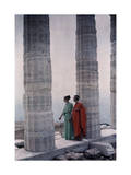 Two Dancers in Costume Stand Between Columns of Poseidon's Temple Photographic Print by Maynard Owen Williams