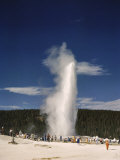 Tons of Vistors Watch Old Faithful Erupt Every 66.5 Minutes Photographic Print by Edwin L. Wisherd