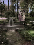 Two Women Pose Beside an Artesian Well Photographic Print by Edwin L. Wisherd