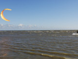 Young Man Kiteboarding in the Gulf of Riga Photographic Print by Keenpress 