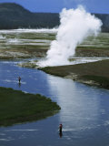 Two Men Fly Fishing for Trout Near a Steaming Hot Spring Photographie par Paul Chesley