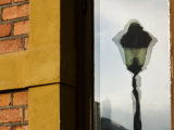Reflection of a Street Light in Window Photographic Print by Mattias Klum