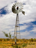 Windmill Being Blown around by the Wind in Outback Australia Photographic Print by Brooke Whatnall