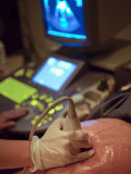 Pregnant Woman Receiving an Ultrasound Medical Exam Photographic Print by Greg Dale