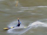 Kayaker Throws His Paddle in the Air Surfing a Standing Wave Photographie par Skip Brown