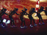 Skaters in Costume Performing in a Circus Act Photographie par Paul Chesley