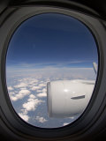 View Out of an Airplane Window During Flight Photographic Print by Greg Dale