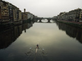 Lone Rower Plys the Calm Waters of a Canal in Florence, Italy Photographie par Paul Chesley